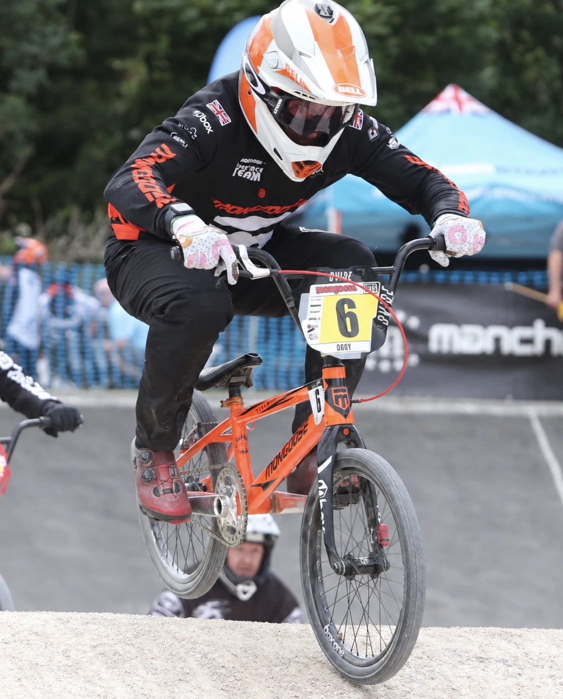 BMX racer wearing Saints of Speed gloves
