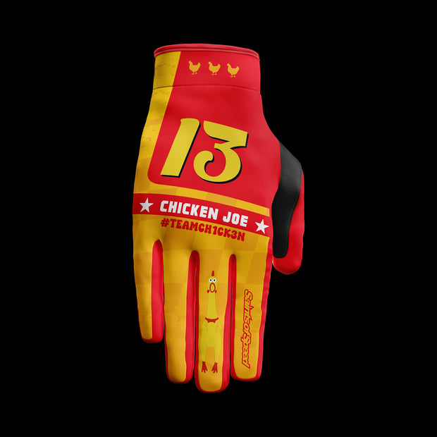 Motocross gloves in red and yellow featuring "Chicken Joe," number 13, and #TeamCh1ck3n branding with a chicken graphic.