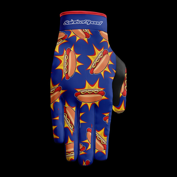 Motocross gloves with a vibrant blue design featuring colorful hot dog graphics and "Saints of Speed" branding.