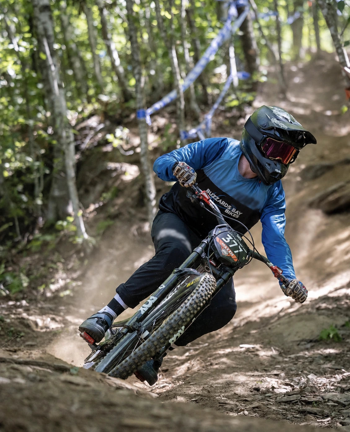 Mountain biker wearing Saints of Speed gloves